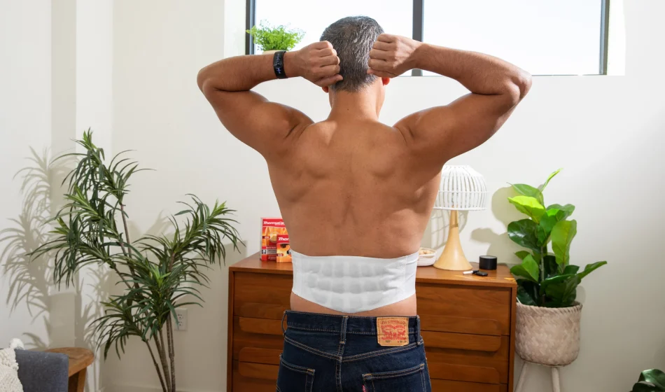 Man wearing ThermaCare back heatwrap
